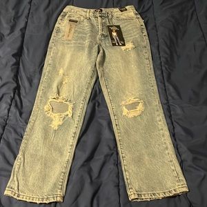 Straight jeans with rips, they will fit you from length if your 5’2 or under.